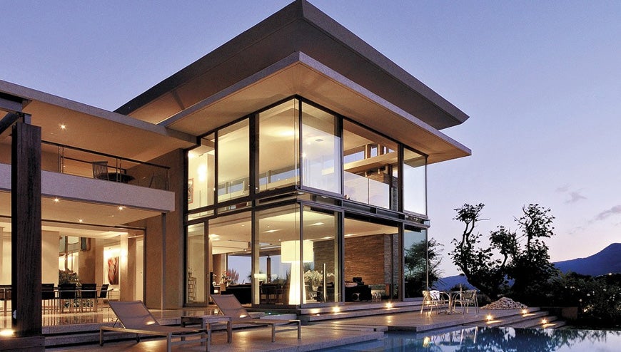 A image showing a well-lit, modern Denver home interior and exterior, with a focus on electrical fixtures and systems
