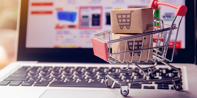 Shopping cart on top of a laptop