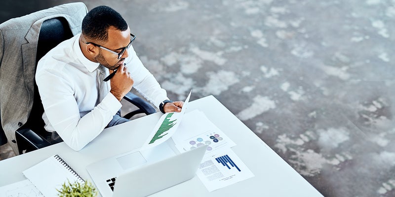 Man in the office reviewing documents