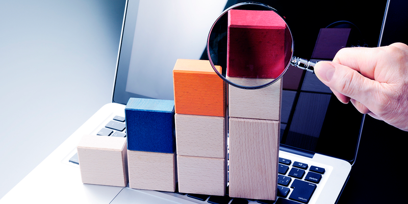 Magnifying glass examining blocks