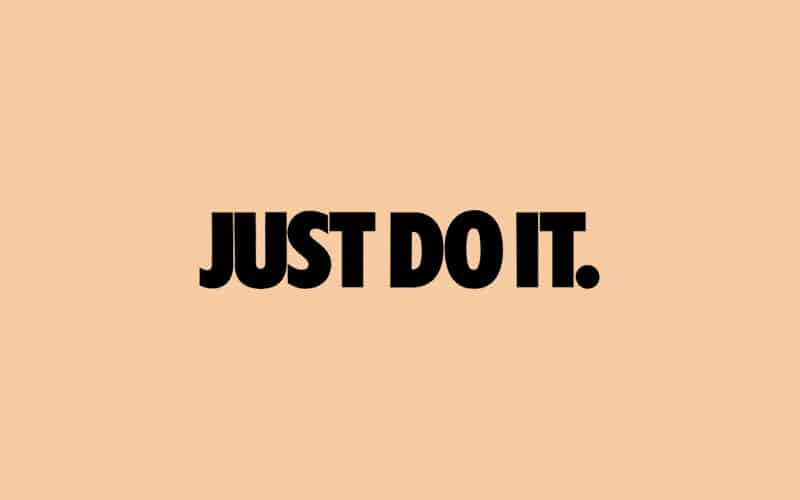 'Just Do It.' in black text on a peach-colored background