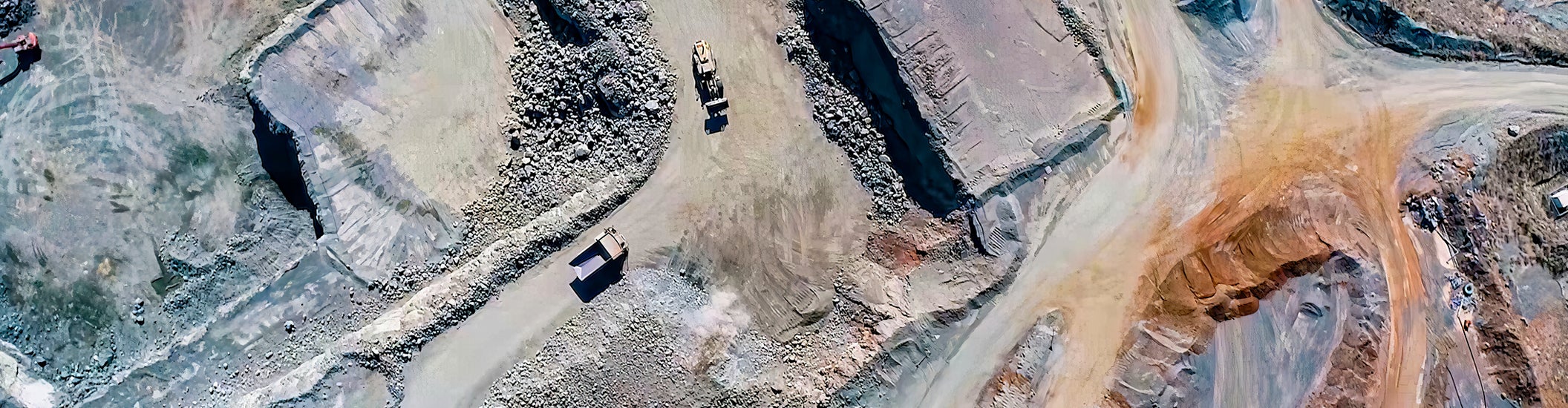 "mining area with trucks"