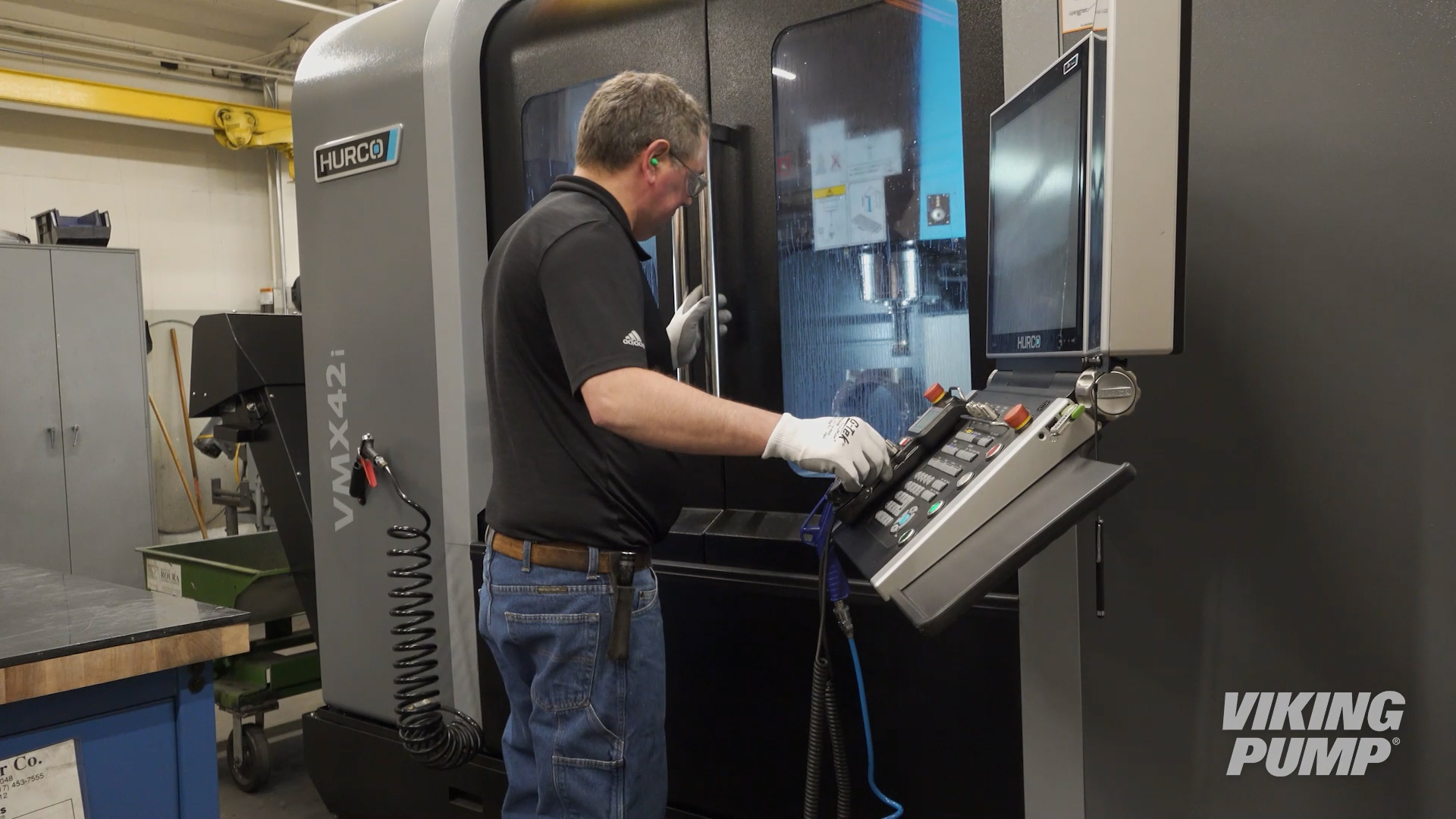 PE lab machinist finishing a pump casing in the vertical machining center