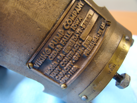Close-up of nameplate from bronze Viking pump that was aboard the USS Cobia