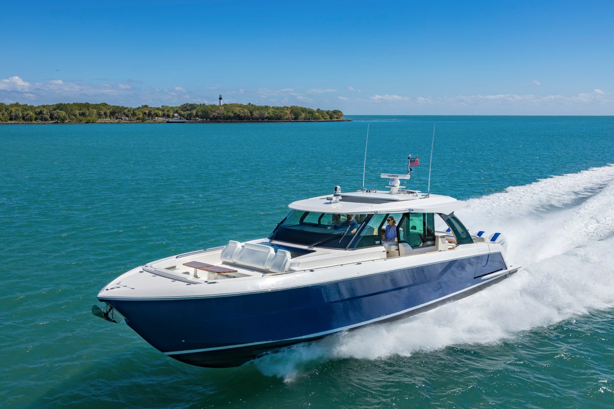 Tiara Yachts 56 LS Running Forward, Bow-on View - Hull Color: Estoril Blue
