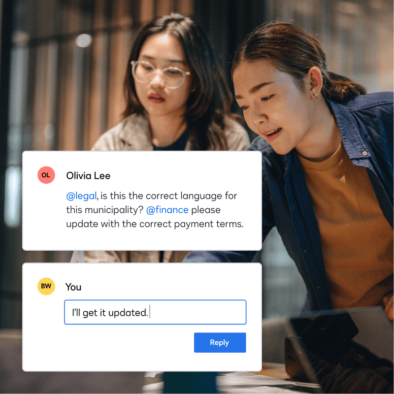 Two people looking at a laptop with a chat conversation
