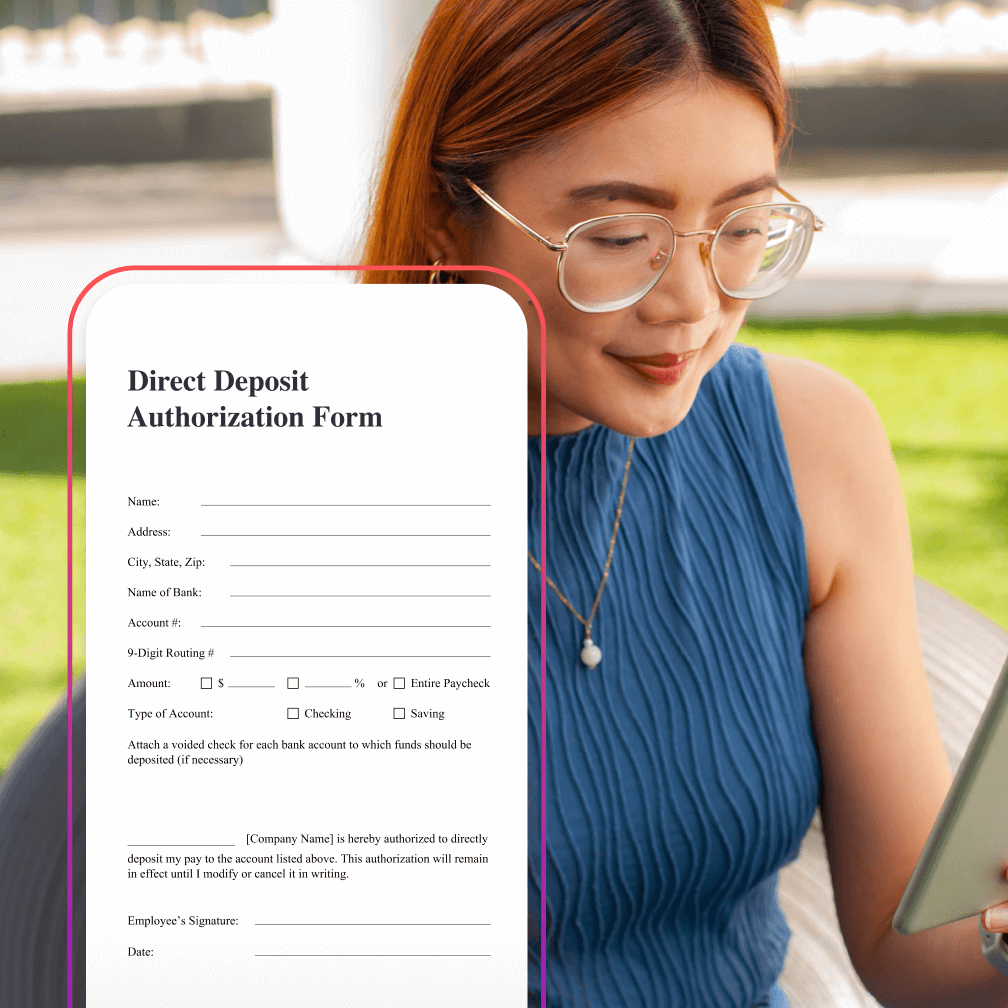 Woman smiling and looking down at phone.