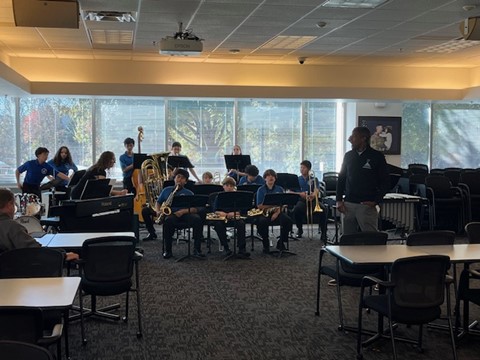 Stone Middle School Jazz Ensemble performing at Gatehouse Administration Center. 