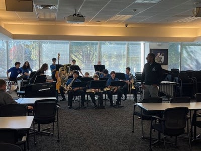 Stone Middle School Jazz Ensemble performing at Gatehouse Administration Center.