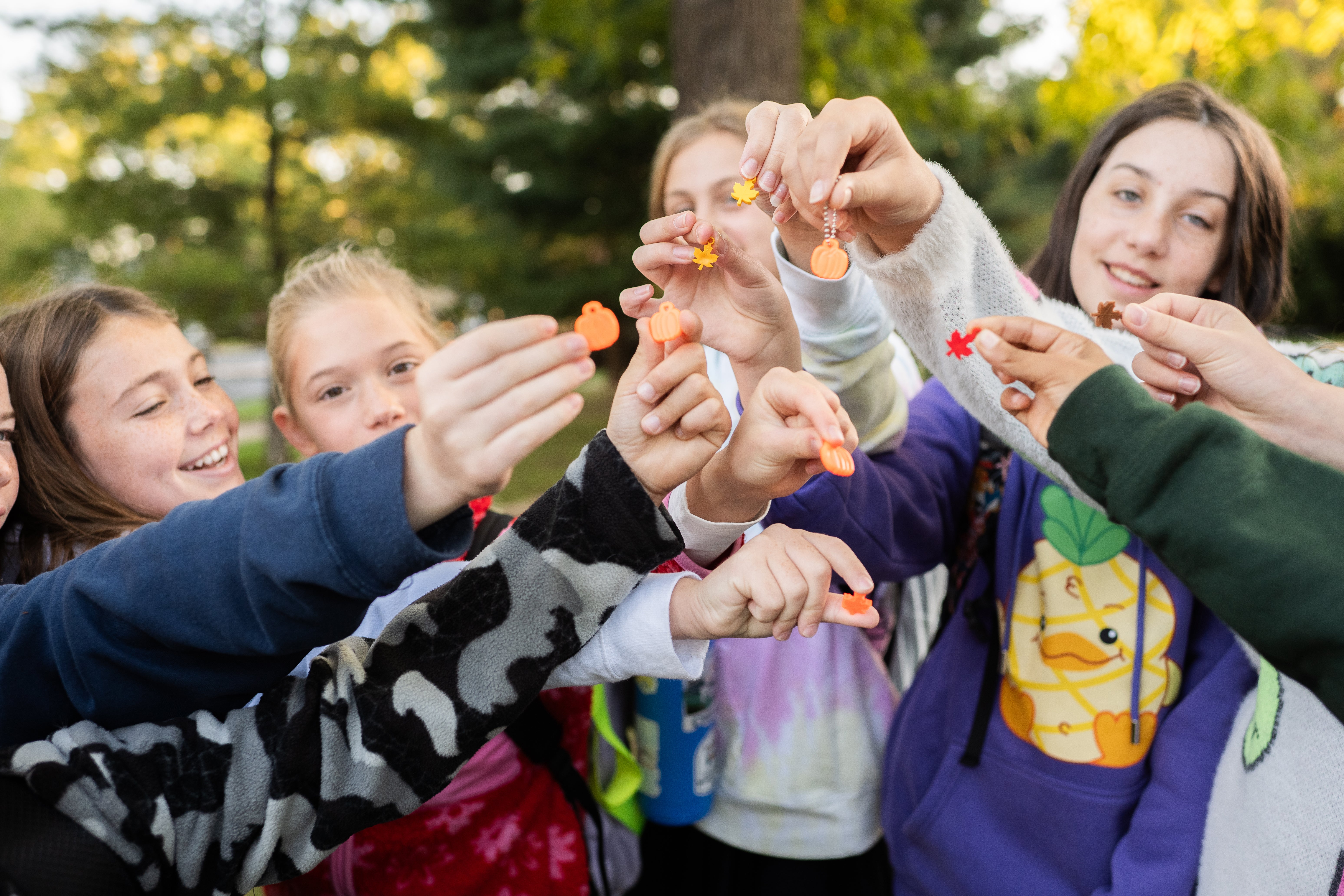 Wolftrap students show off the colorful fall-themed charms they earned for walking to school.