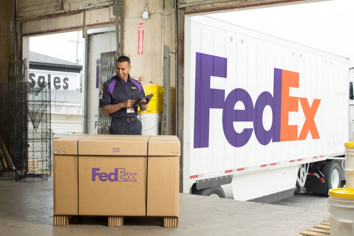 A FedEx courier picks up a FedEx Freight Priority shipment.