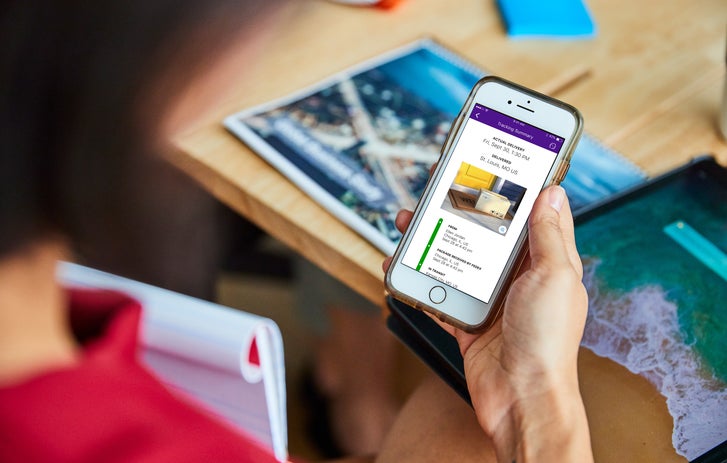 Person looking at the FedEx website on their smartphone