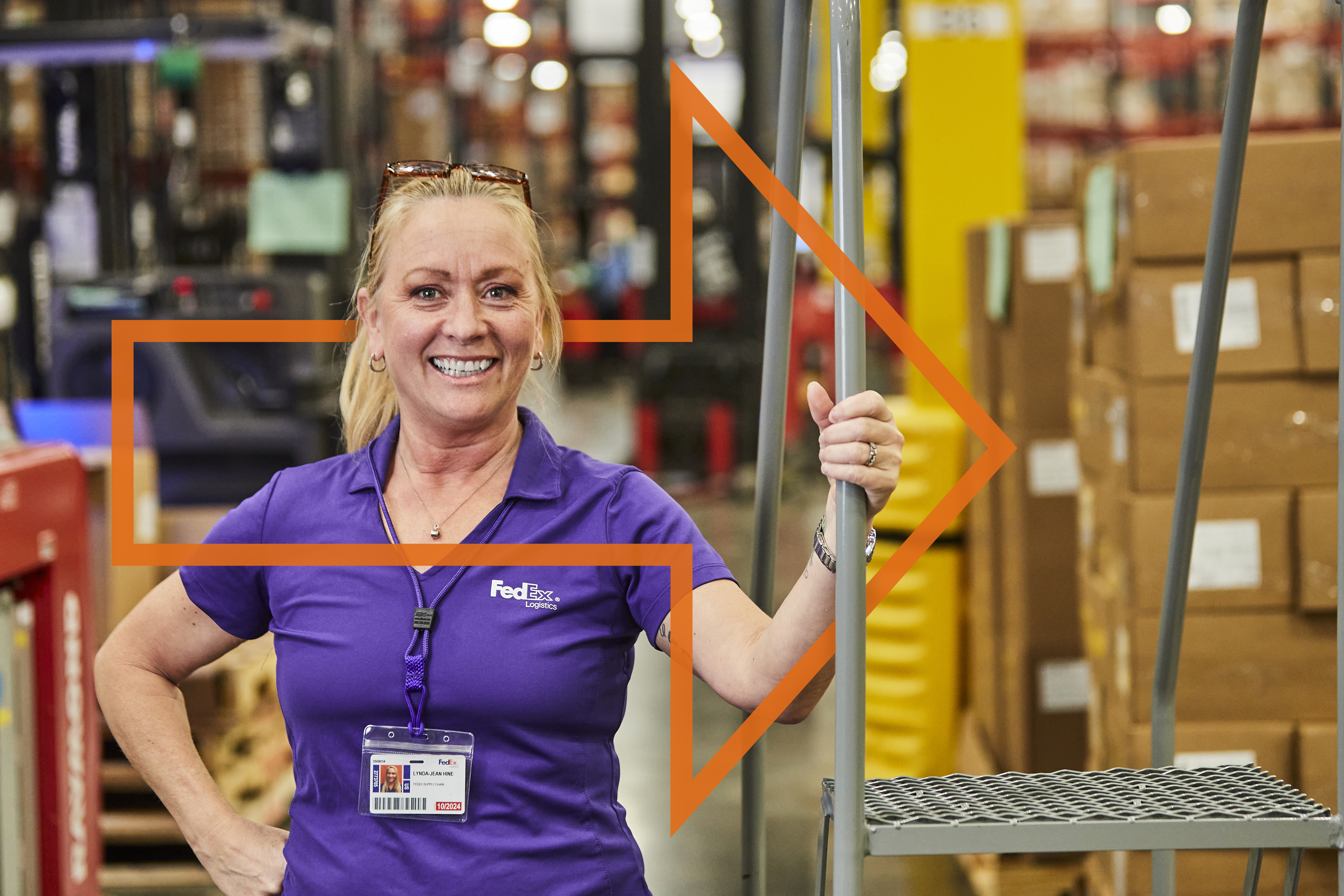 Smiling FedEx employee at a processing center