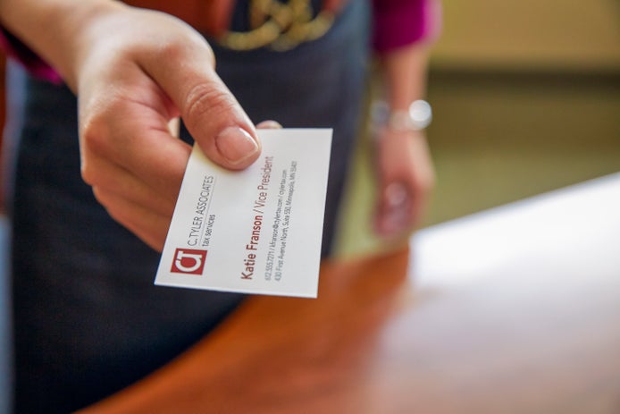 A person handing out a business card