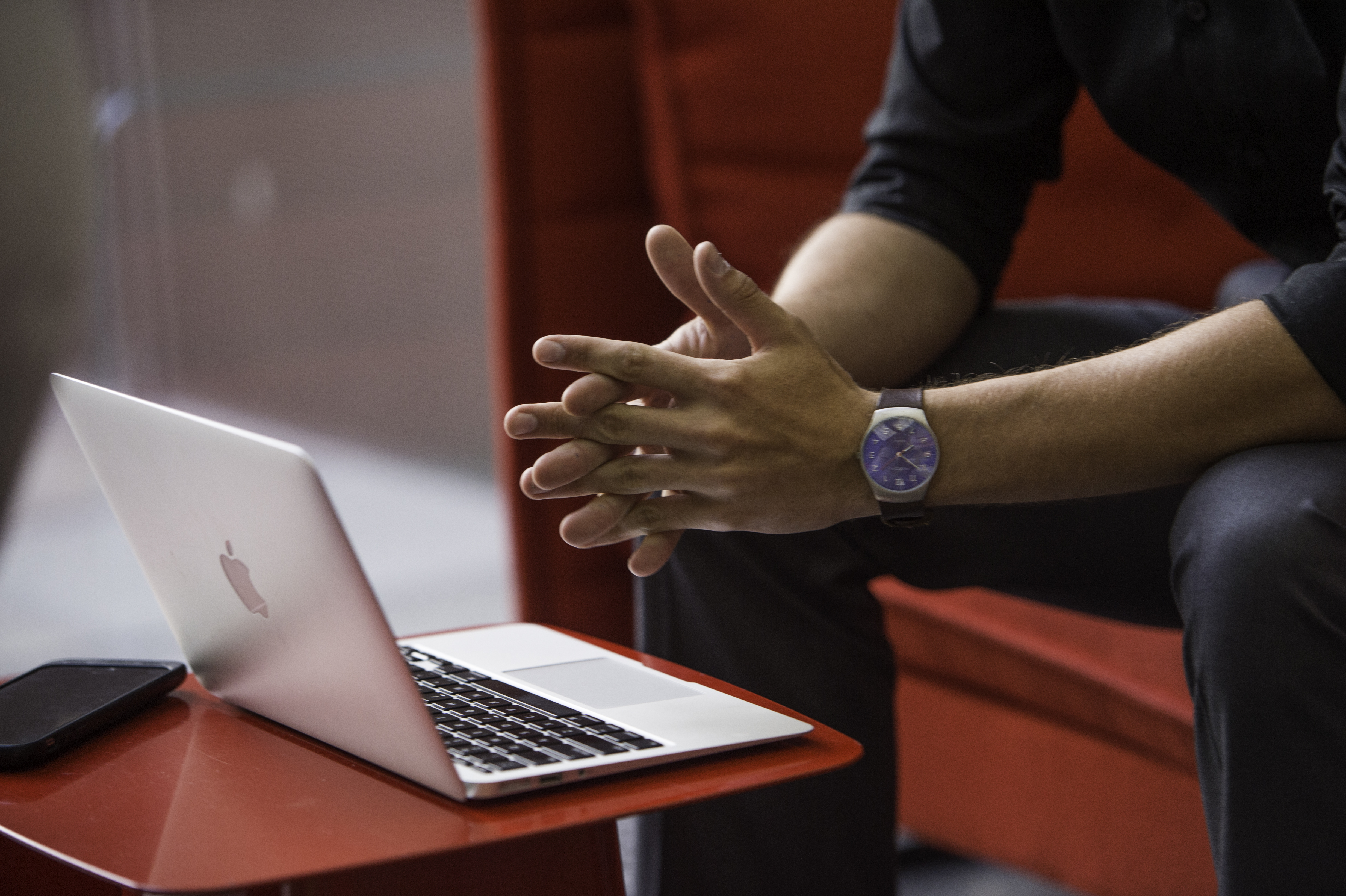 Man sitting down using laptop