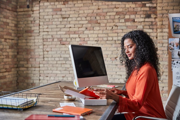 woman sitting in front of computer
