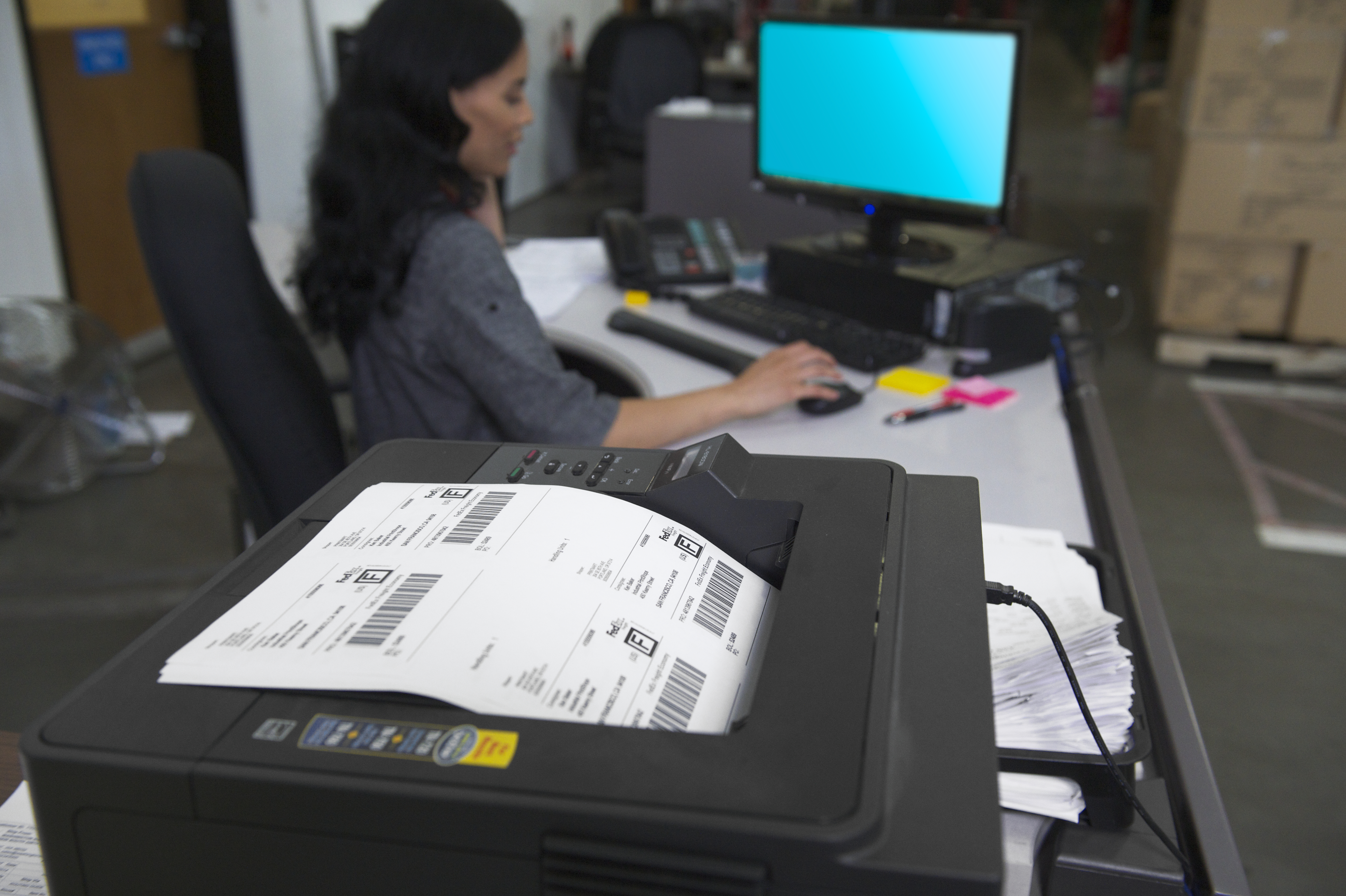 Woman printing shipping labels