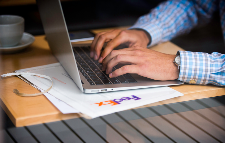 FedEx box and laptop