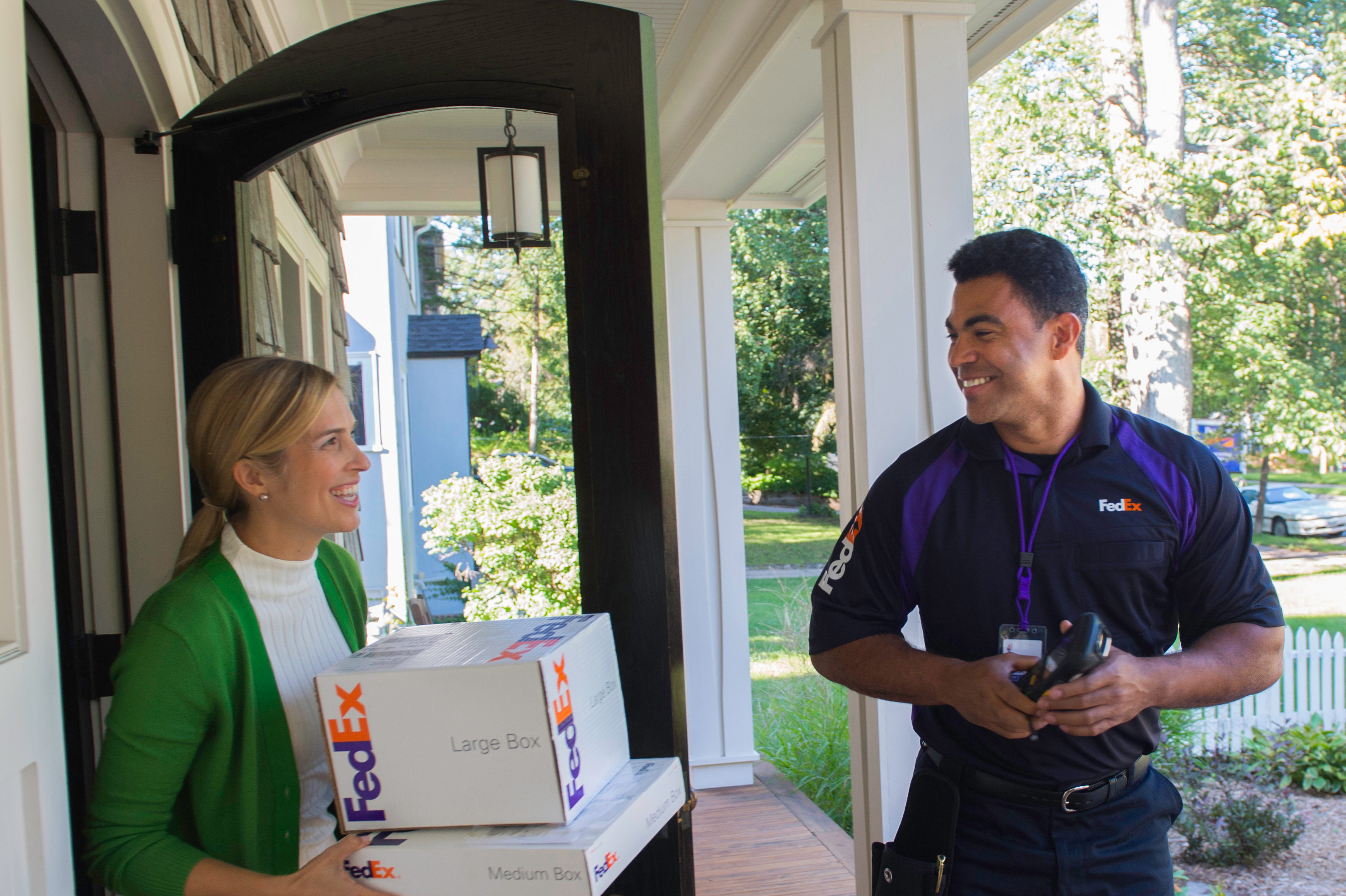 Woman receiving delivery at home