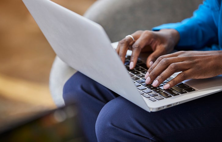 Guy typing on laptop