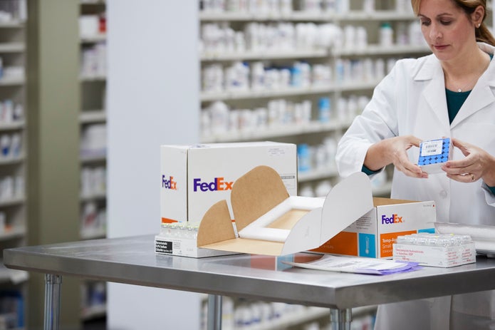 Pharmacist unpacks items from Temp-Assure packaging