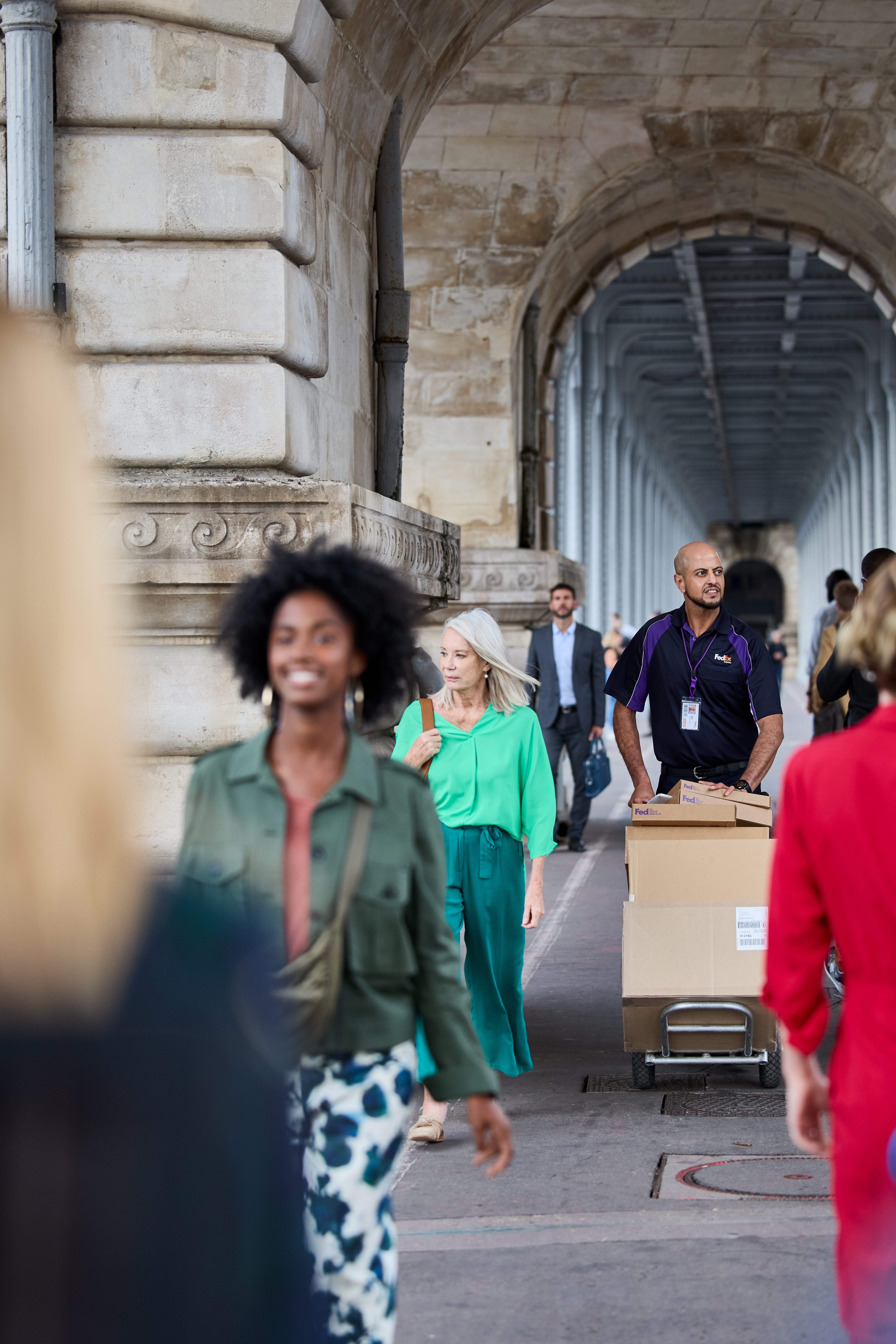 FedEx employee delivering package in Europe