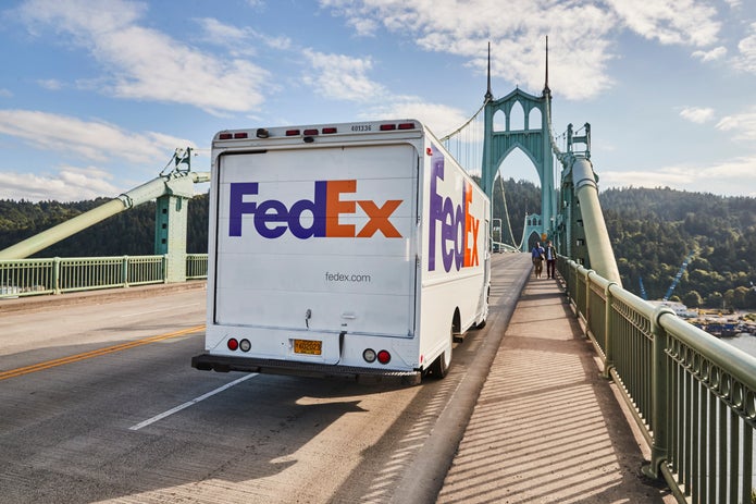 FedEx Ground truck driving on bridge