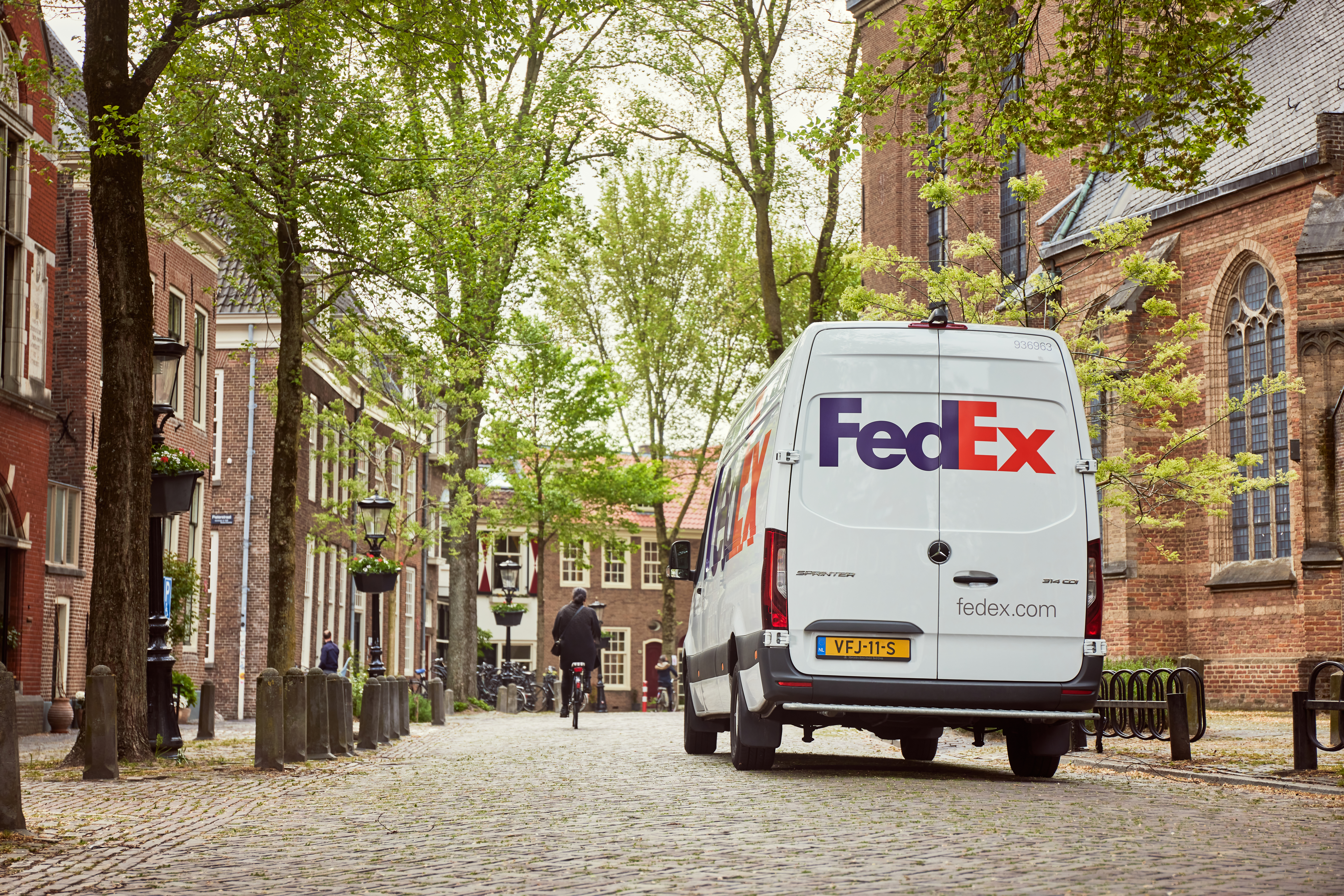 FedEx Express van driving down road