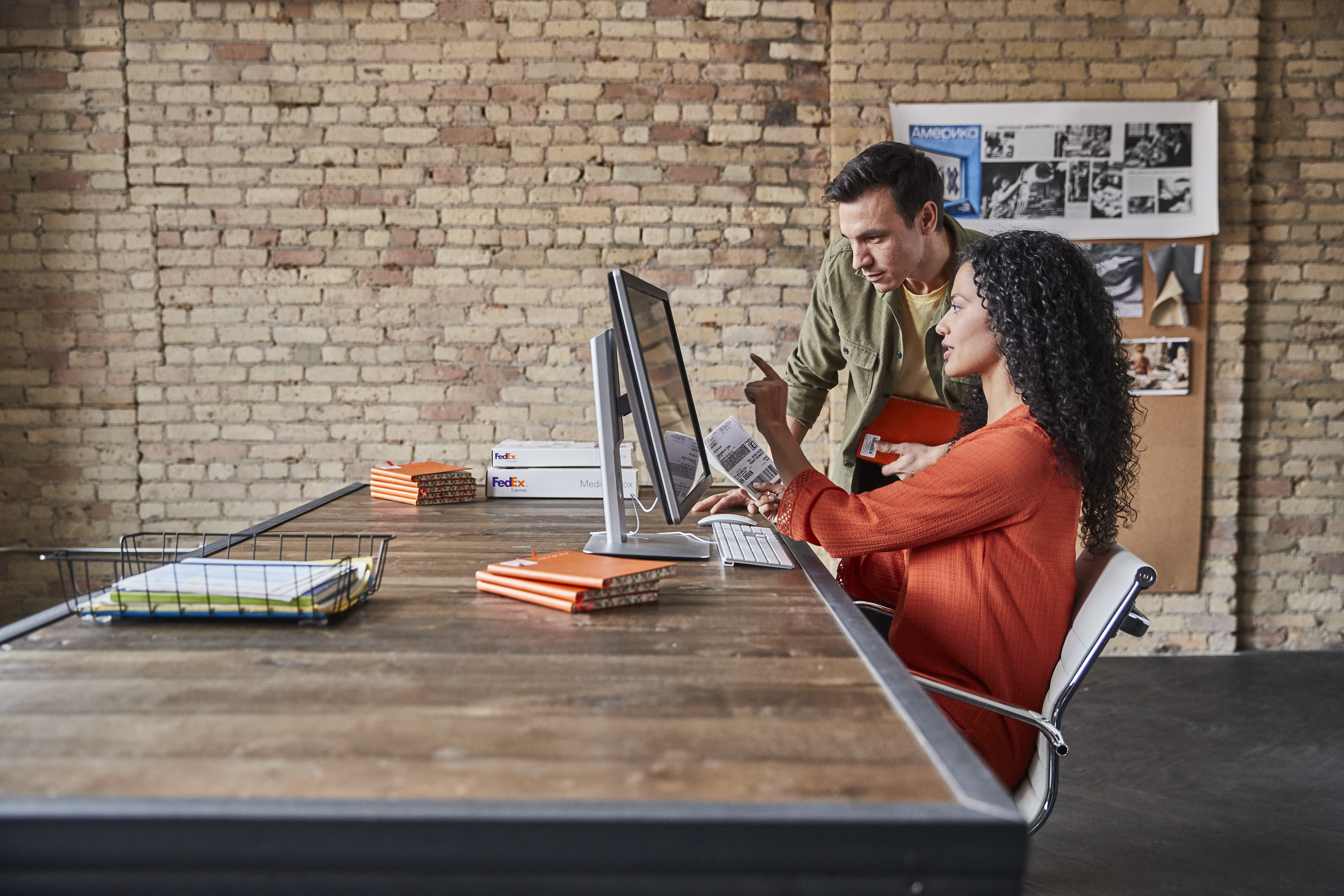 Two people looking at a tablet