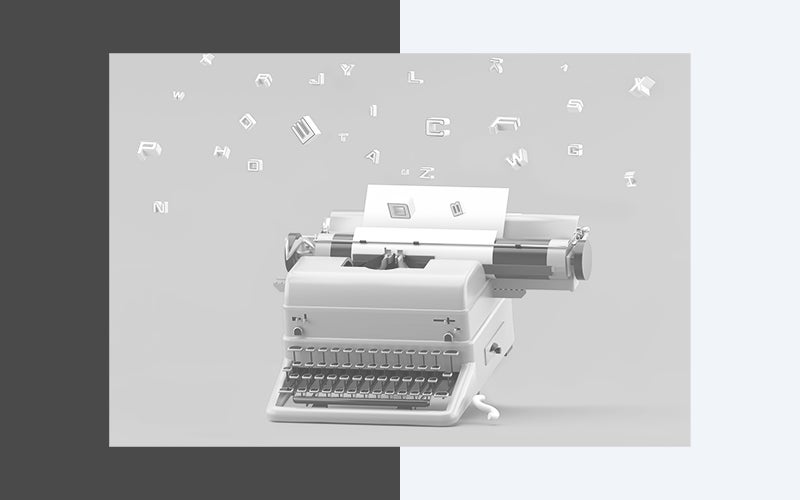 Typewriter with letters flying above it