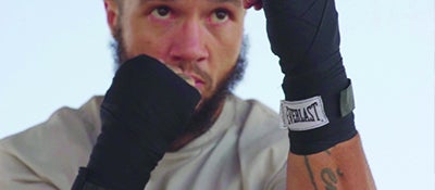 man wearing Everlast boxing gloves