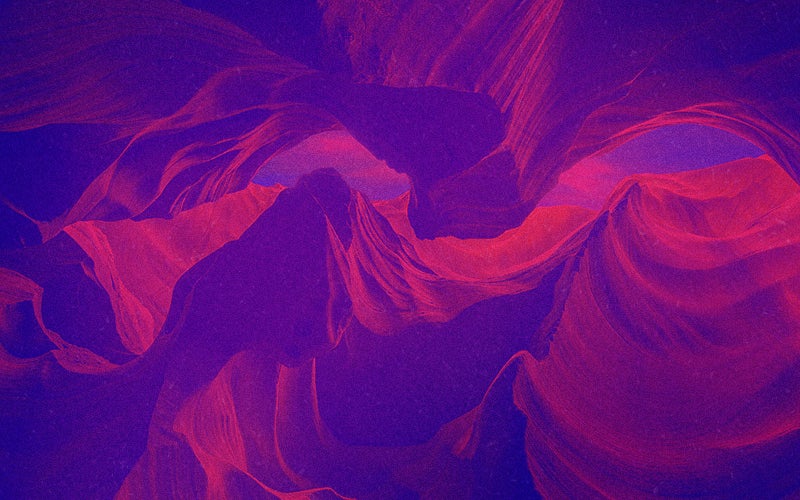 Trippy image of red/purple mountains right side up and upside down