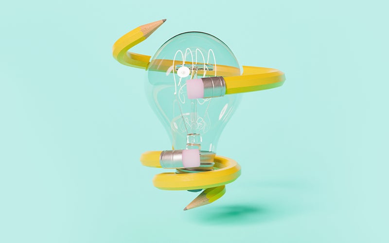 yellow pencil wrapped around a lightbulb on a light green background