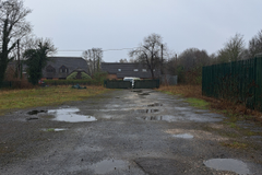 A large plot of land, with fencing around it.