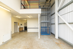 The interior of a warehouse unit, facing the back.