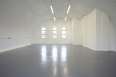 The mezzanine level of an arch with white lining.