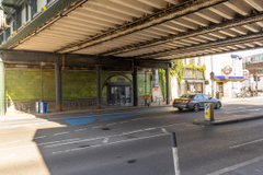 The front of an arch, with glazing on the bottom half and door allowing you to see into the arch interior.