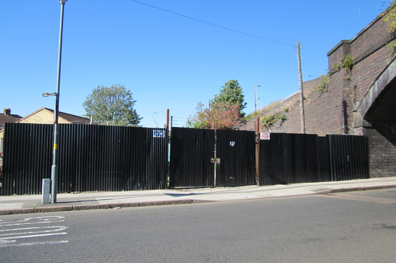A large plot of land, with fencing around it.
