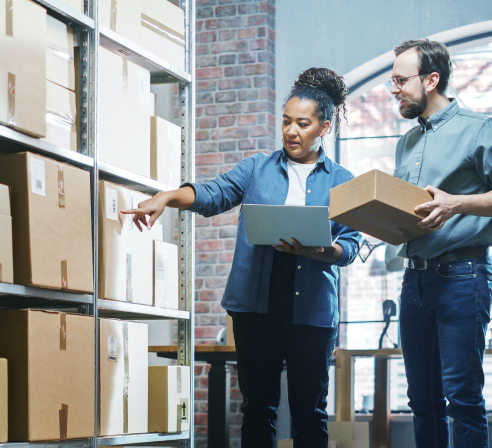 Man and woman discussing their shipment needs and pricing.