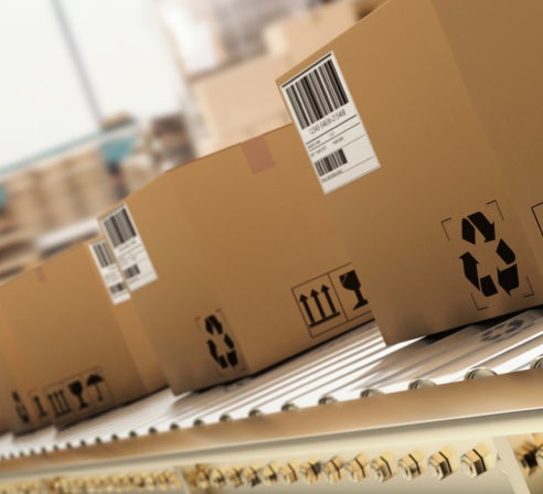 Boxes with shipping labels on a conveyor belt