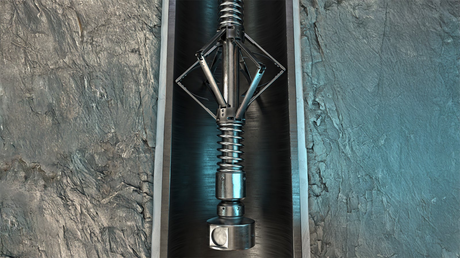 Metallic mechanical device with a spring and angled arms inside a cylindrical housing, placed against a textured rock surface.