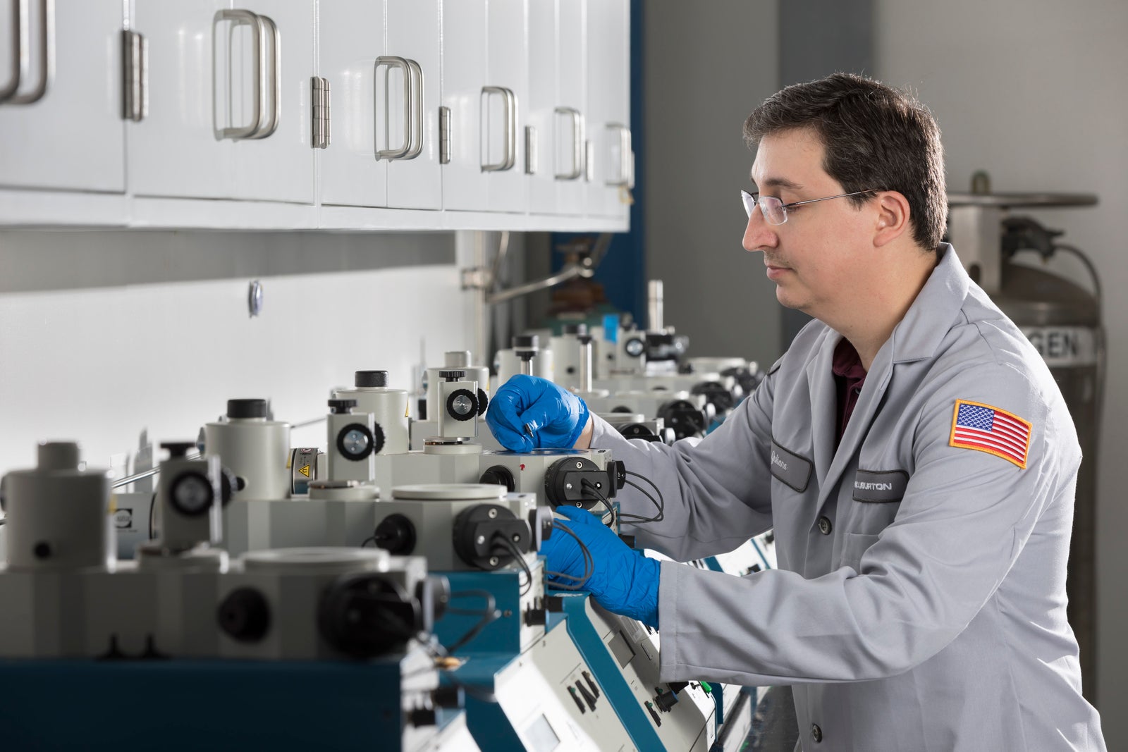 Halliburton lab technician preparing a sample.