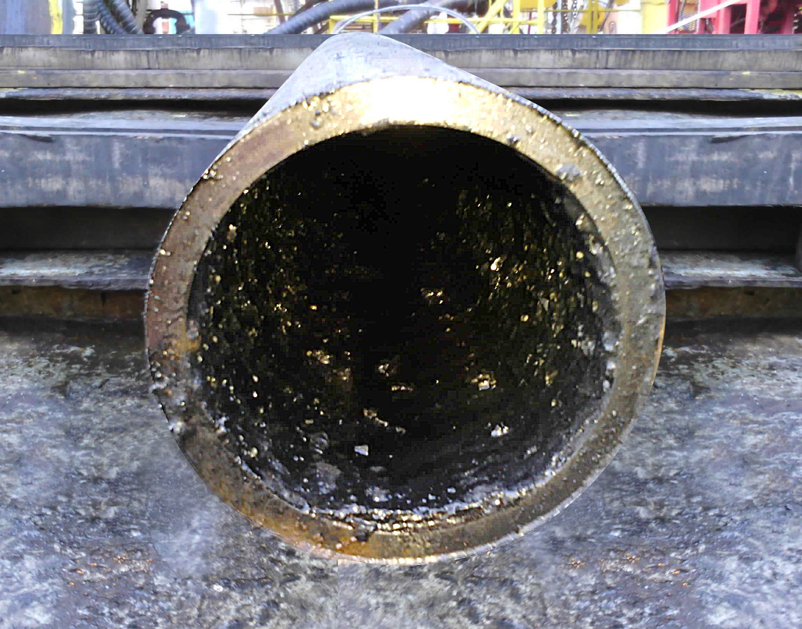 Interior of a large horizontal metallic pipe.