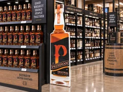 Printed bottle standee on a retail floor
