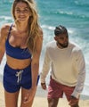 man and woman doing jump squats wearing vuori on a track