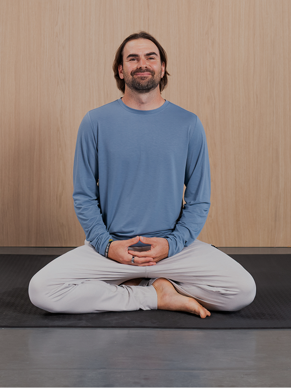 man sitting in a mediation posture