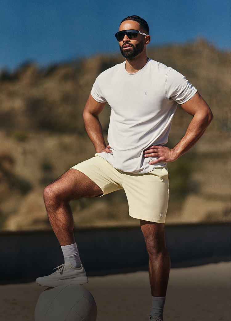 man wearing vuori banks session short in seed