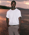man wearing vuori clothing in front of sunset