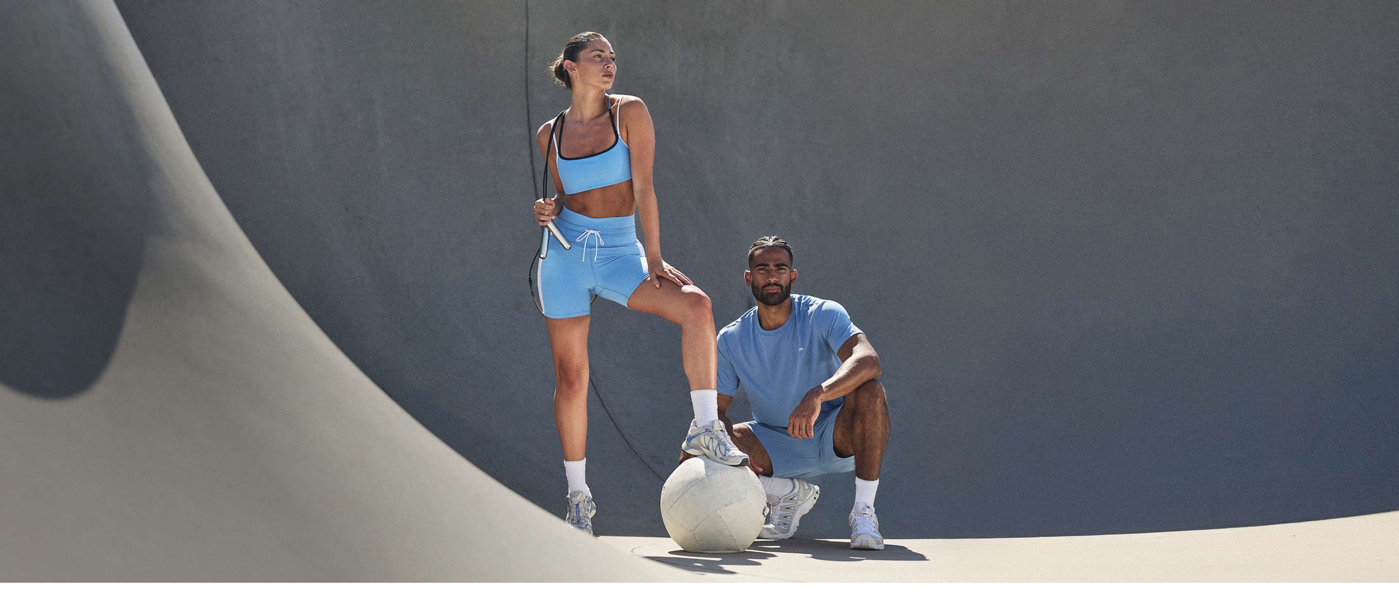 man and woman wearing vuori clothing