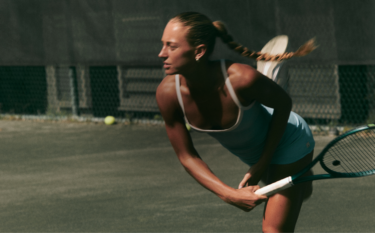 woman wearing vuori clothing for tennis